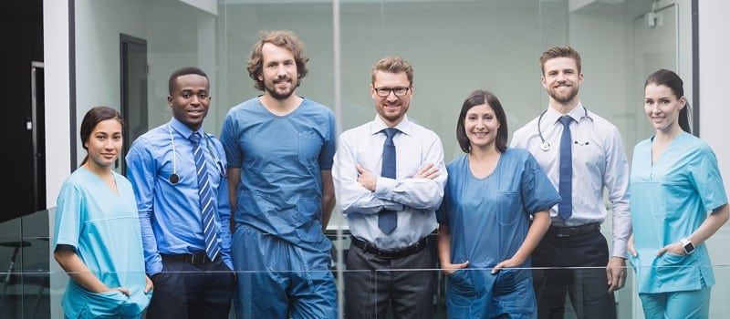 Doctor reviewing home loan documents with mortgage broker in Australia